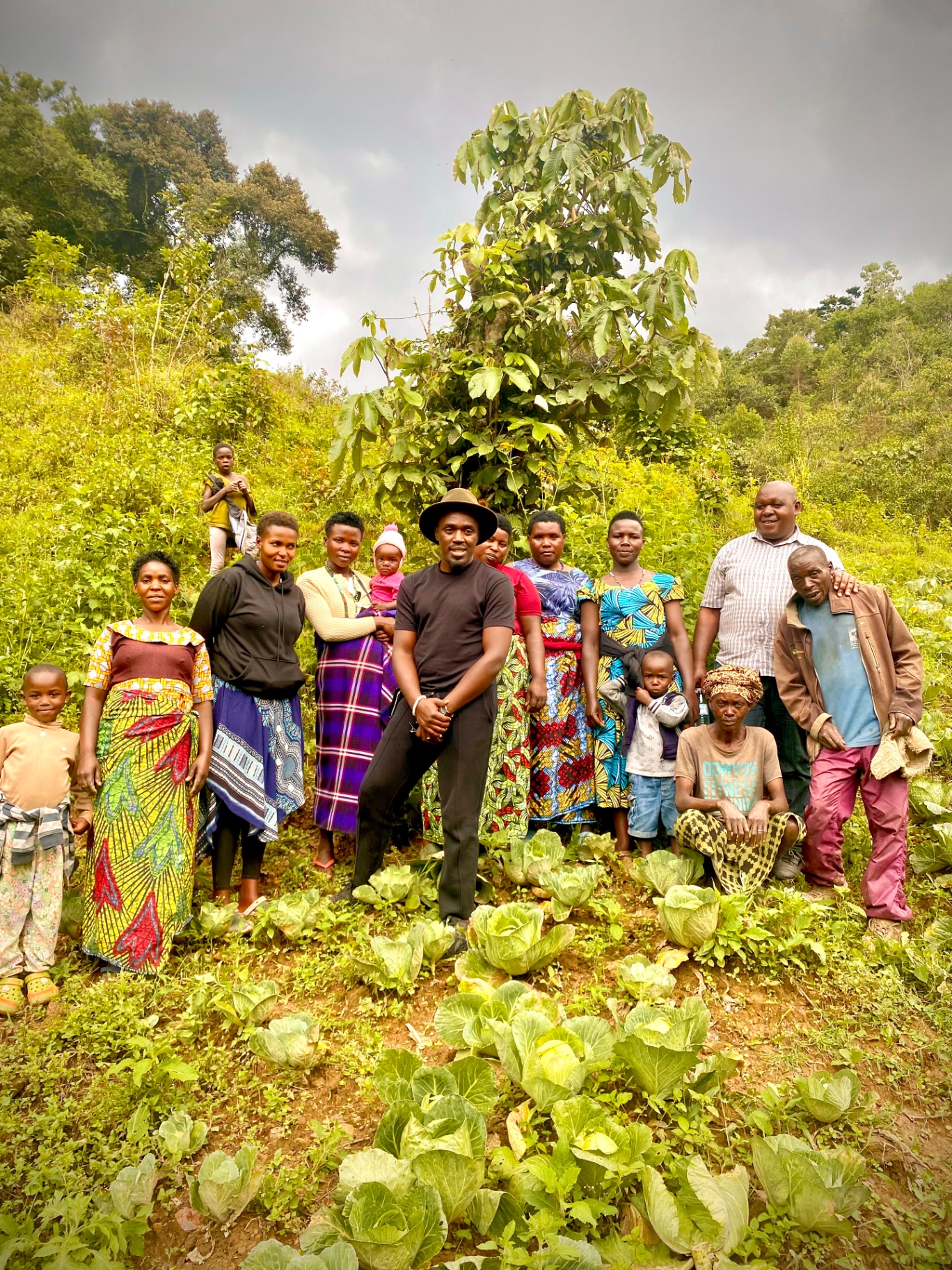 Recab Mwesigye with community members in Uganda